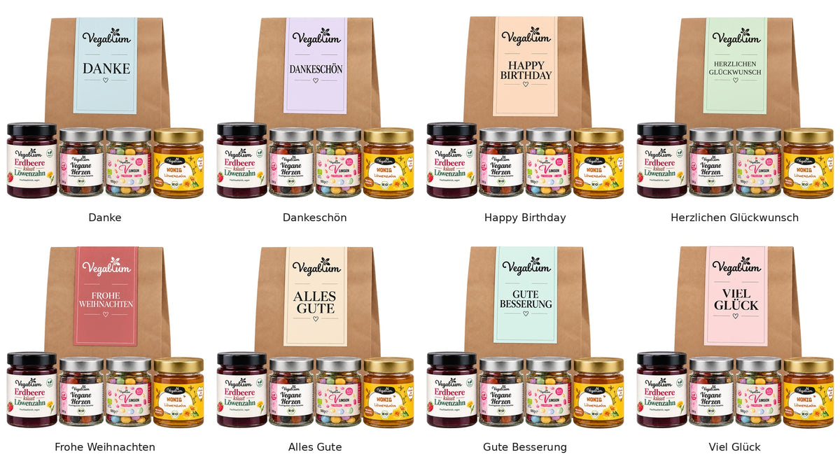 Übersicht aller acht veganen Geschenktüten mit farbigen Grußetiketten