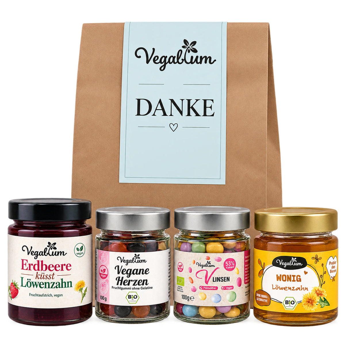 Vegane Geschenktüte mit vier Leckereien und hellblauem Danke Grußetikett