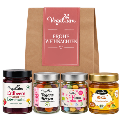 Vegane Geschenktüte mit Grußetikett Frohe Weihnachten und vier Vegablum Leckereien